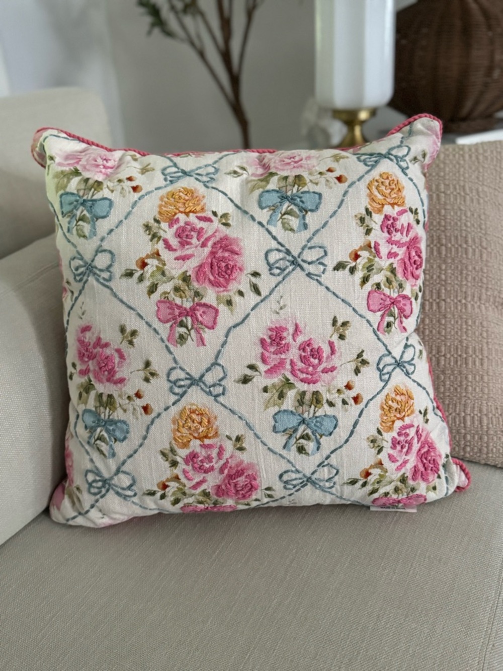 20” x 20” throw pillow features a trellis pattern with embroidered